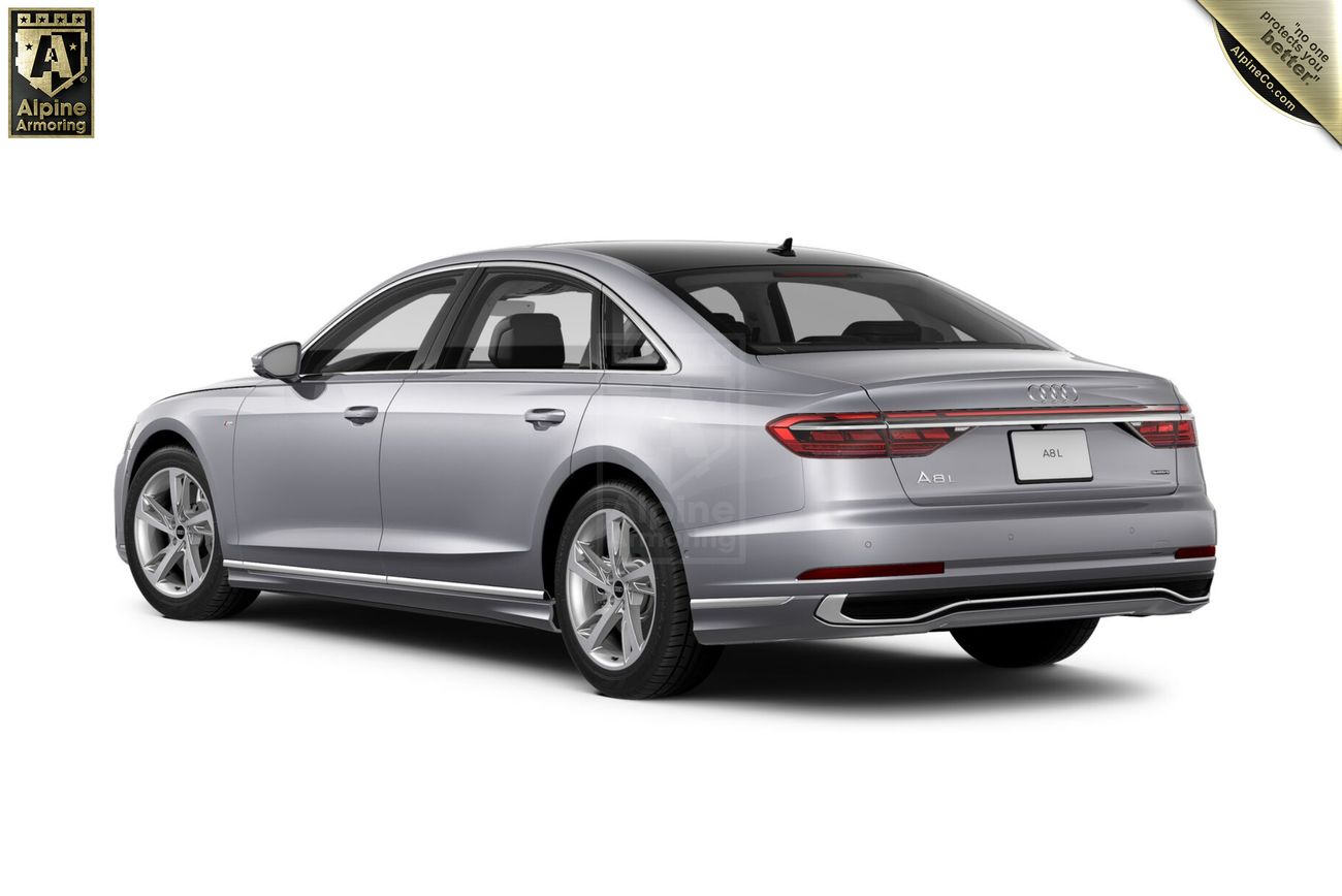 A silver Audi A8 sedan, viewed from the rear-right angle, showcasing its sleek design and luxury features.