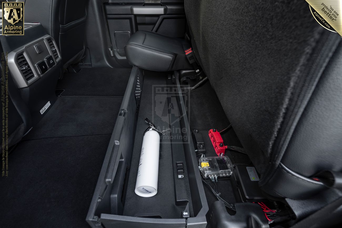 Close-up of a Mastiff dashboard with a "Fire" pull handle, vent, gauge cluster.