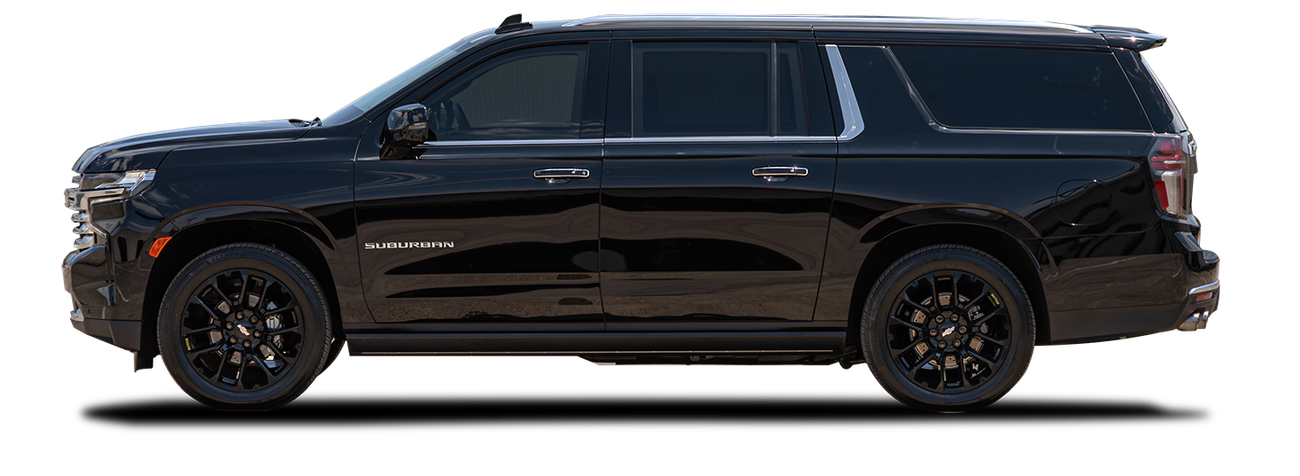 Image of a black Chevrolet Suburban taken from the driver side.