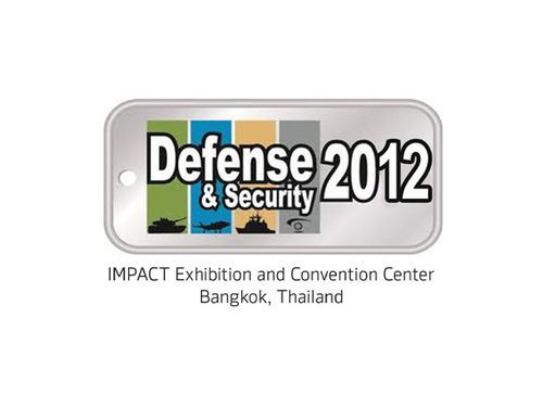 A logo for the Defense & Security 2012 event, featuring a dog tag design with the text 'Defense & Security 2012